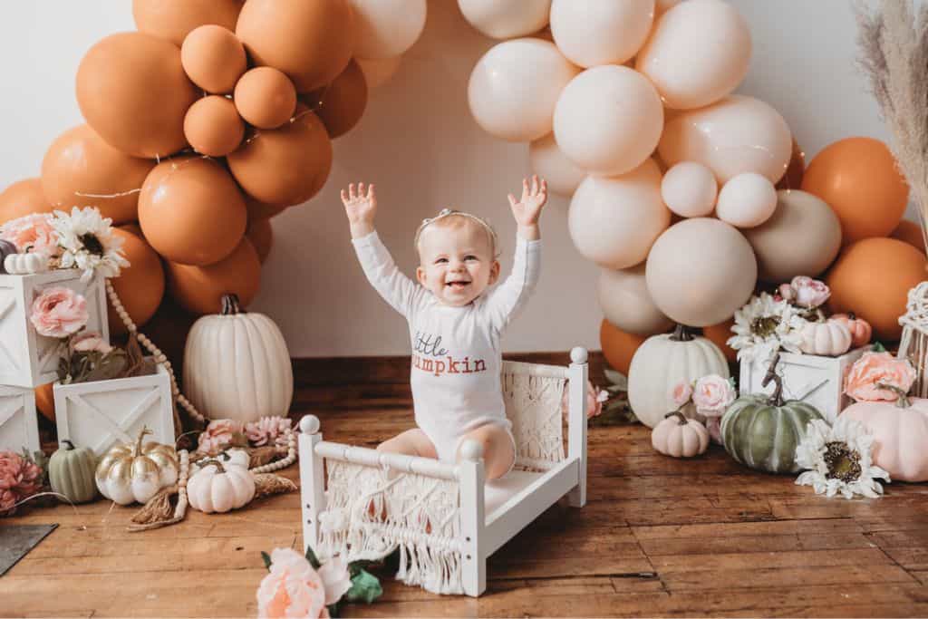 A photo shoot is a memorable way to celebrate a first birthday without a party.