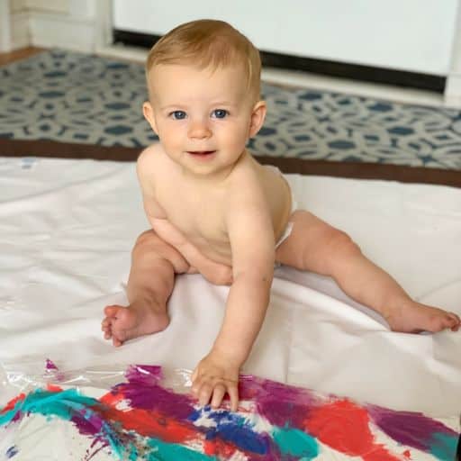 Painting a canvas is an artistic way to celebrate a first birthday without a party.