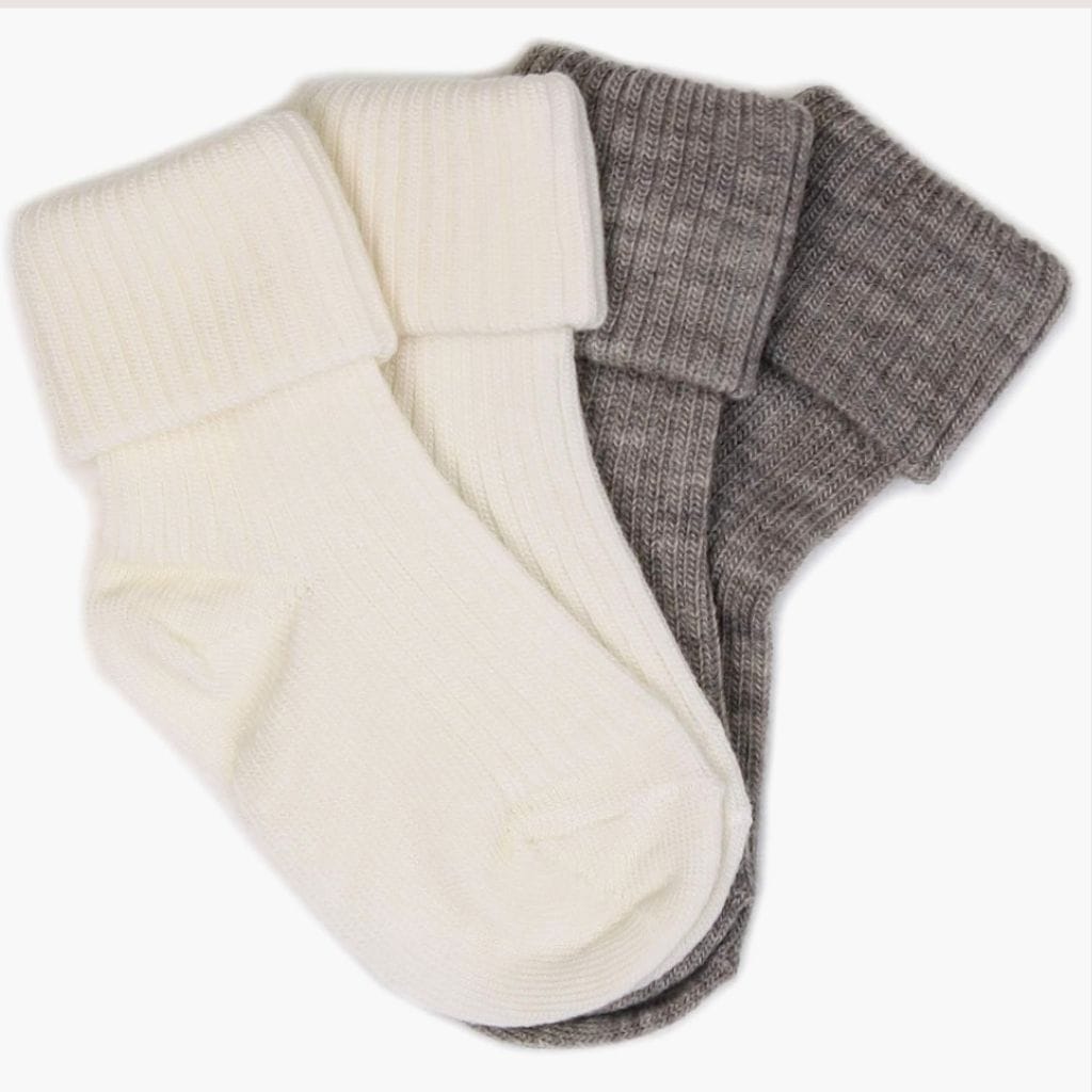 newborn winter clothes include merino wool socks.